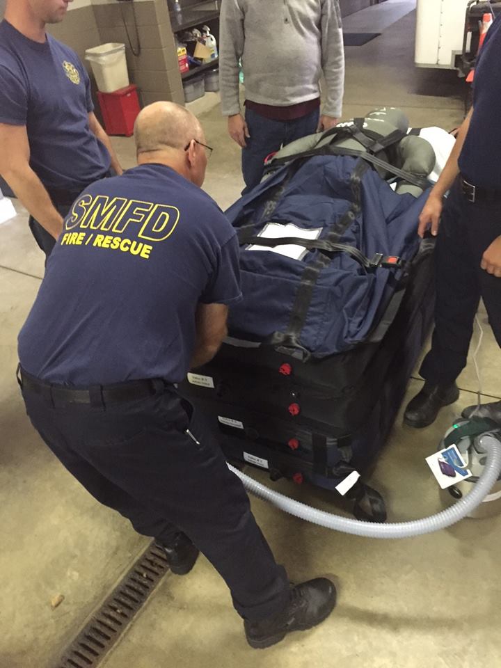 Firefighters Transporting a Dummy